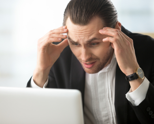 Businessman in despair because of bad news